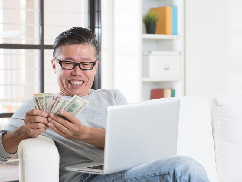 how to make money on fiverr - person counting his money
