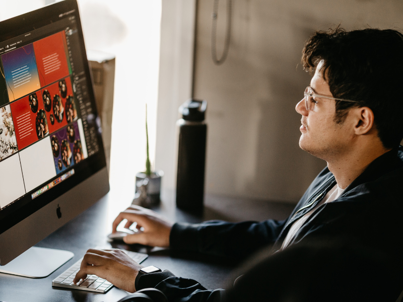 what does royalty free mean - designer looking at images on a PC